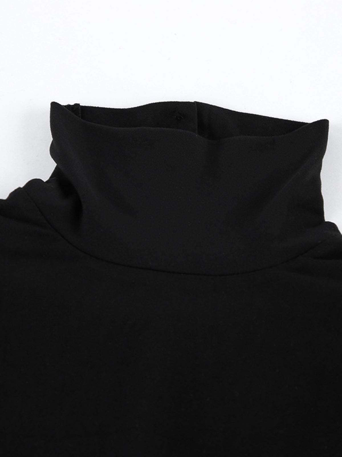 Close-up of black bodycon maxi dress turtleneck collar
