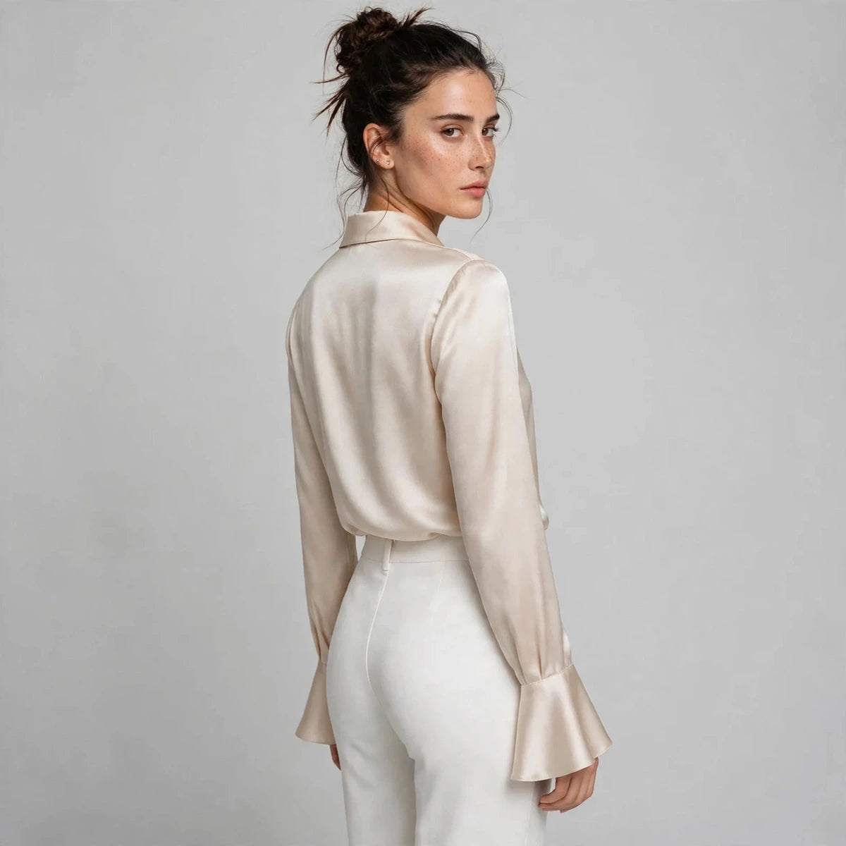 Back view of beige satin collar blouse with flared sleeves