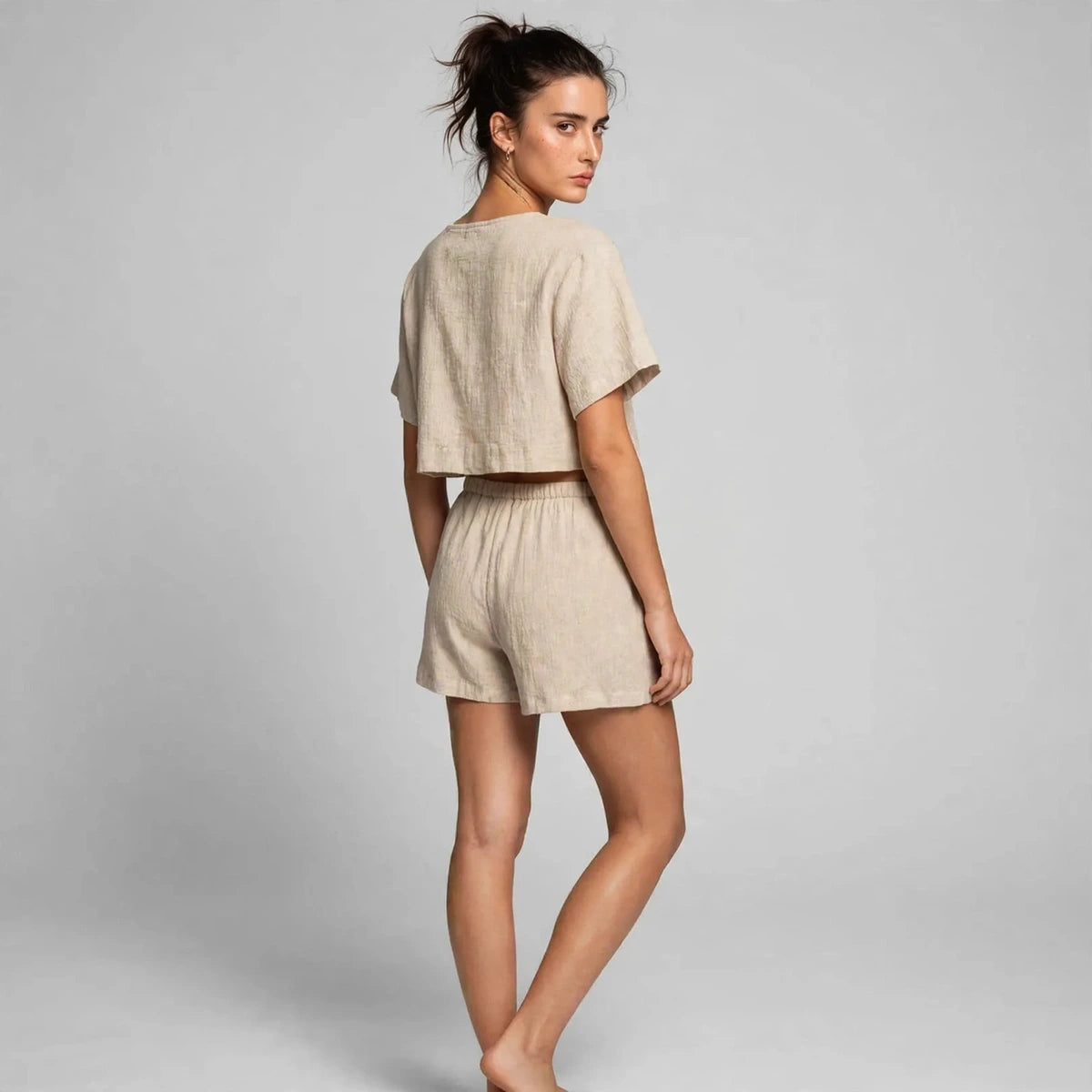 Back view of beige plaid tie-front top and shorts set