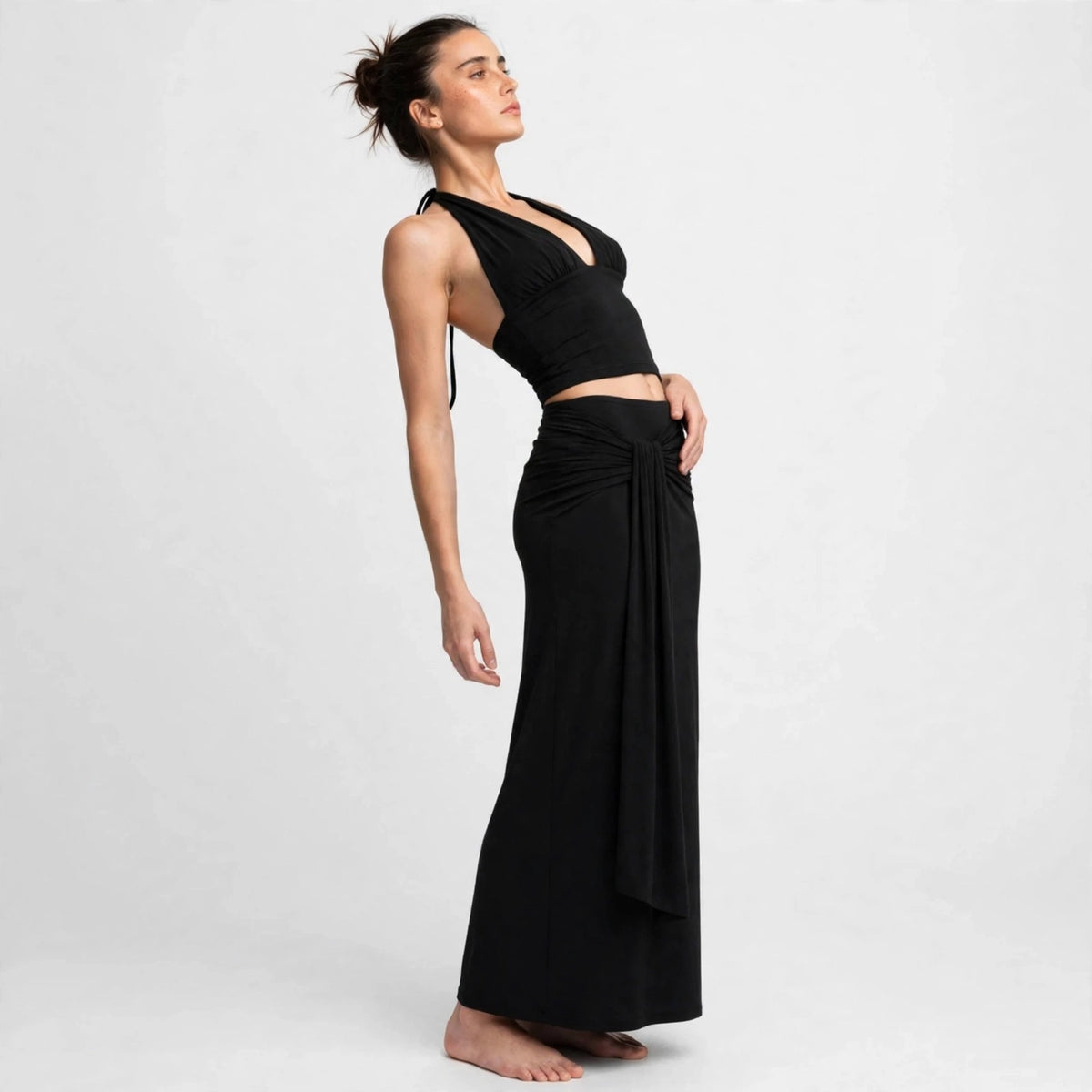 black halter crop top maxi skirt set – three-quarter view, head tilted back