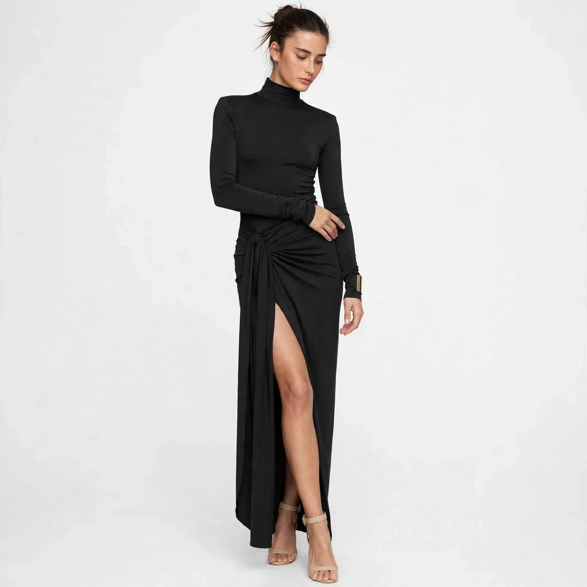 Back view of black turtleneck maxi dress with tie waist