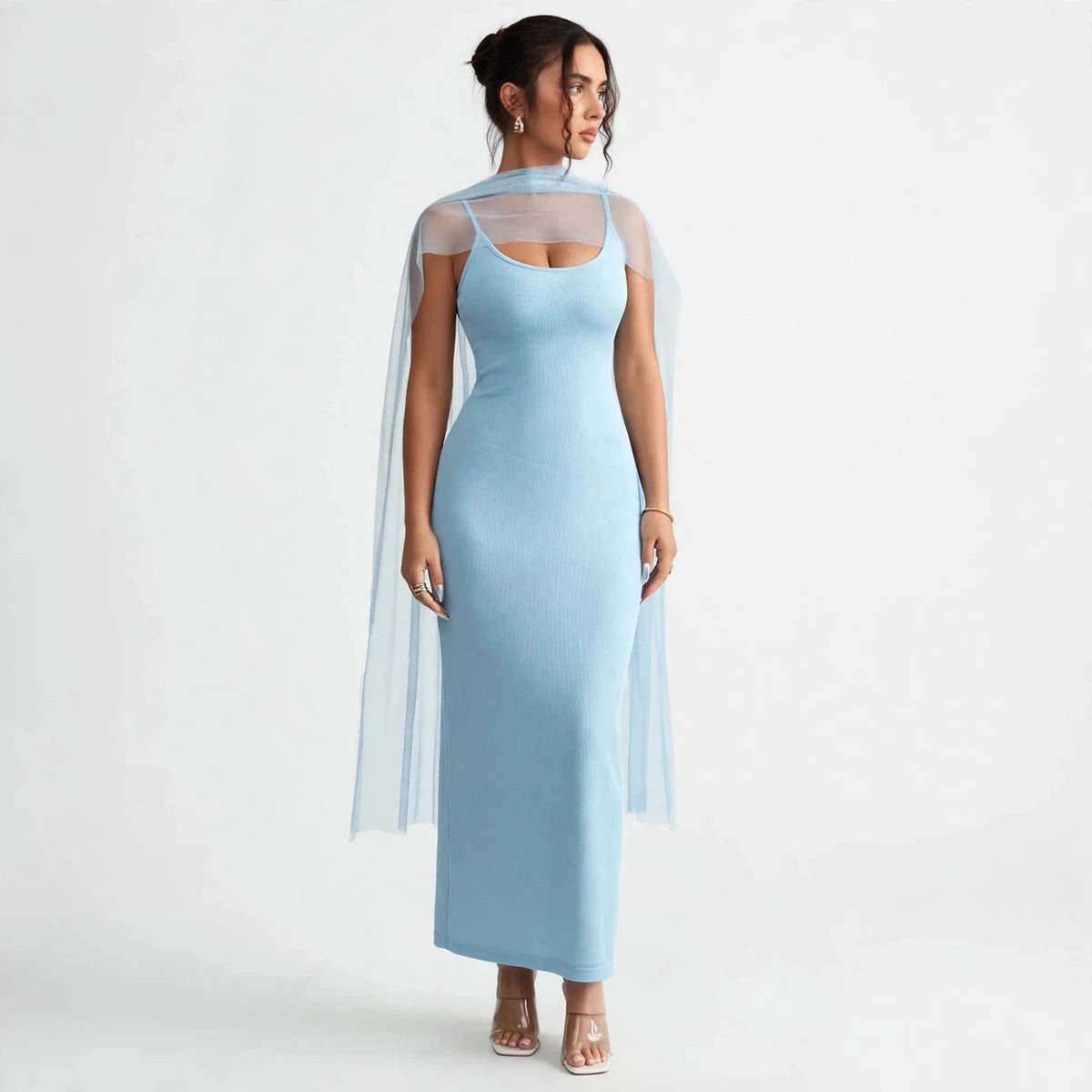 Three-quarter view of light blue scoop-neck bodycon dress with sheer shoulder cape