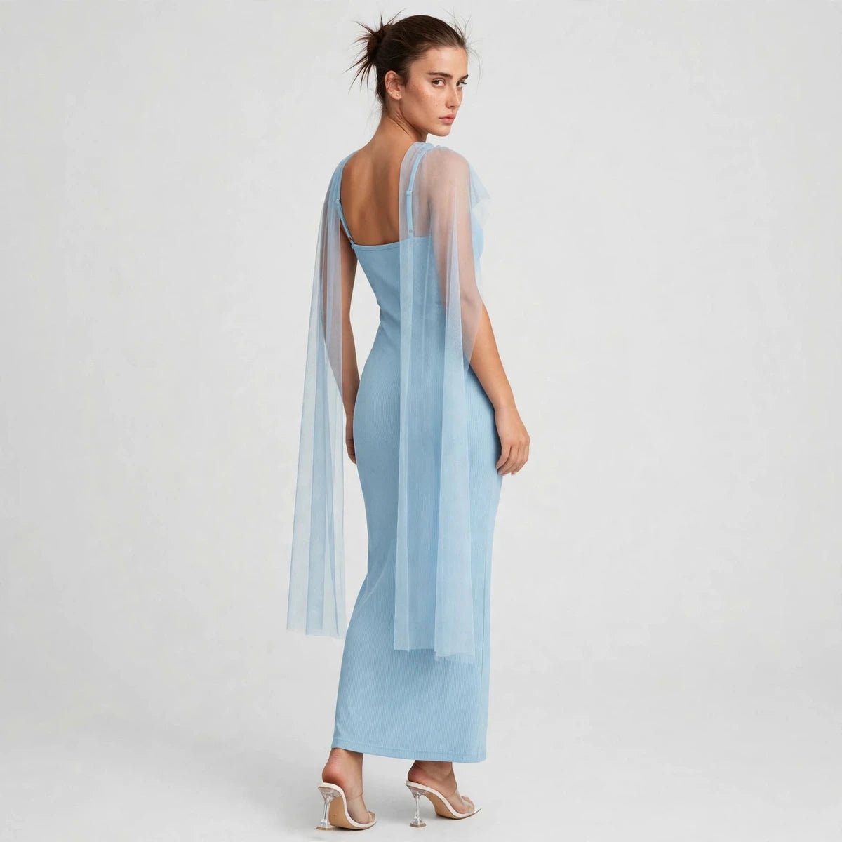 Back view of light blue ribbed bodycon maxi dress with sheer drape hanging behind