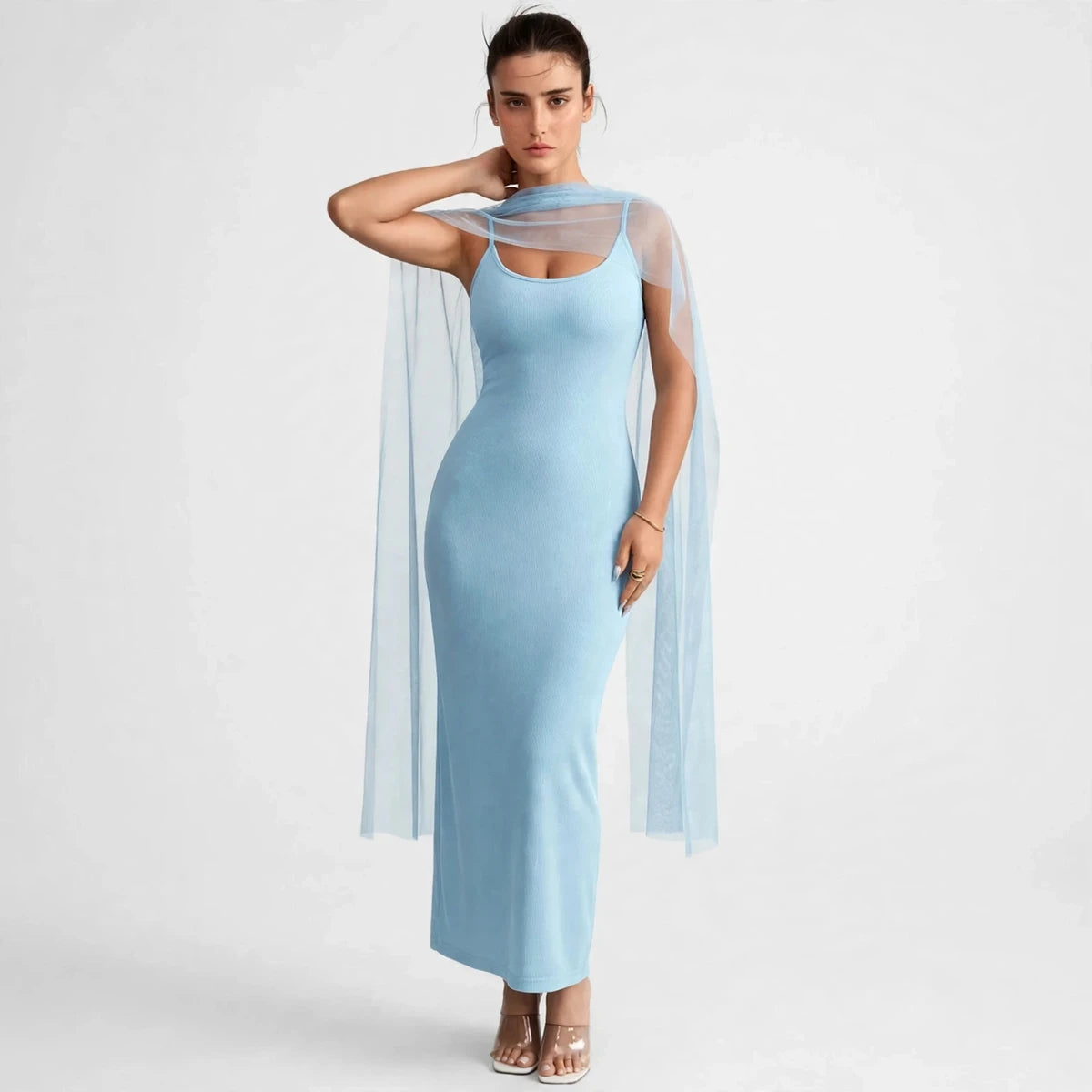 Side view of light blue ribbed bodycon maxi dress with flowing sheer cape overlay