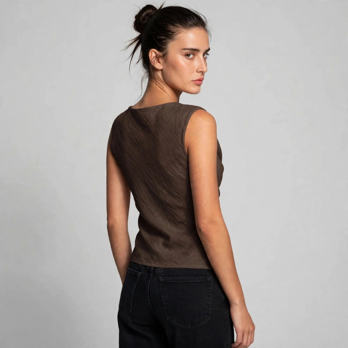 Back view of a brown sleeveless cowl neck tank top with a rounded neckline