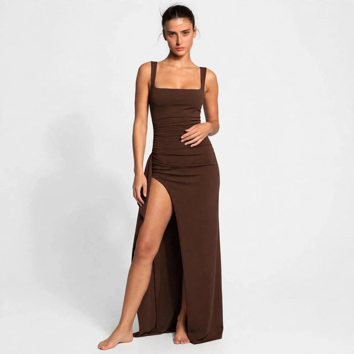 brown ruched high slit maxi dress – front view, hand on waist