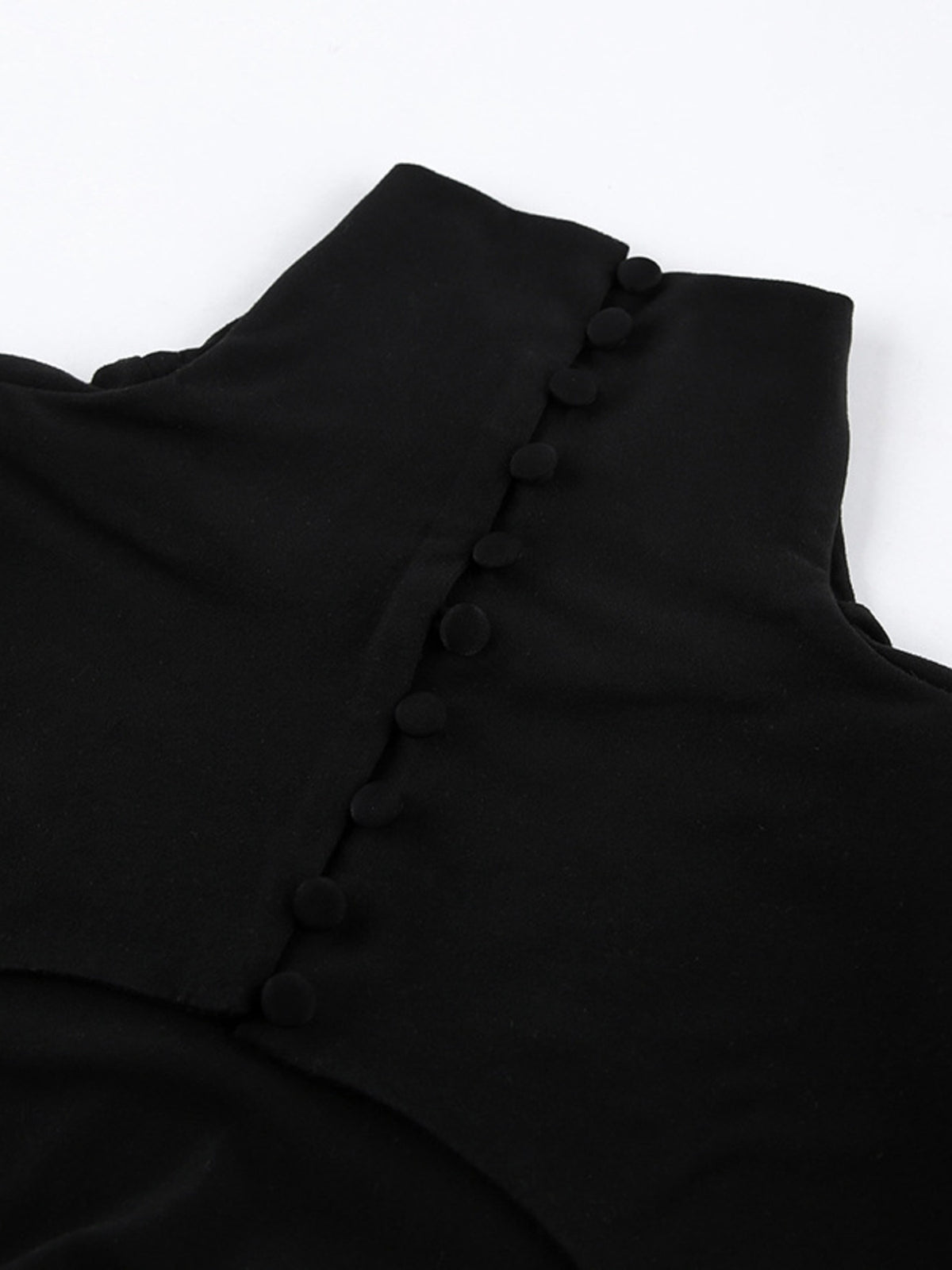 Close-up of back button closure on black bodycon maxi dress turtleneck