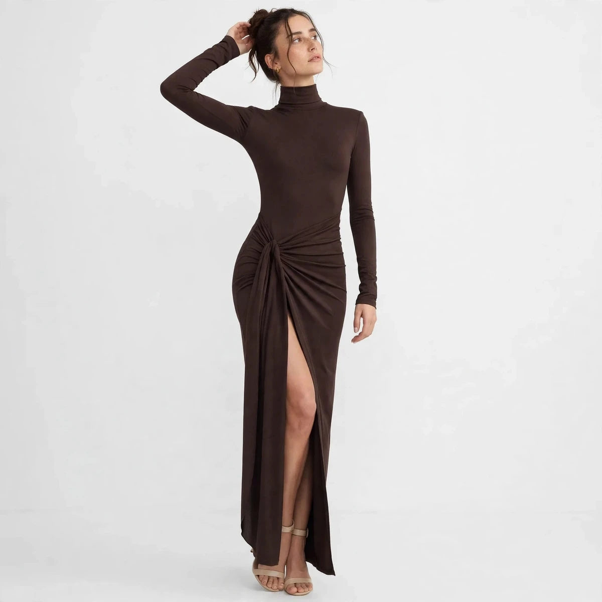 Back view of brown turtleneck maxi dress with knotted tie waist