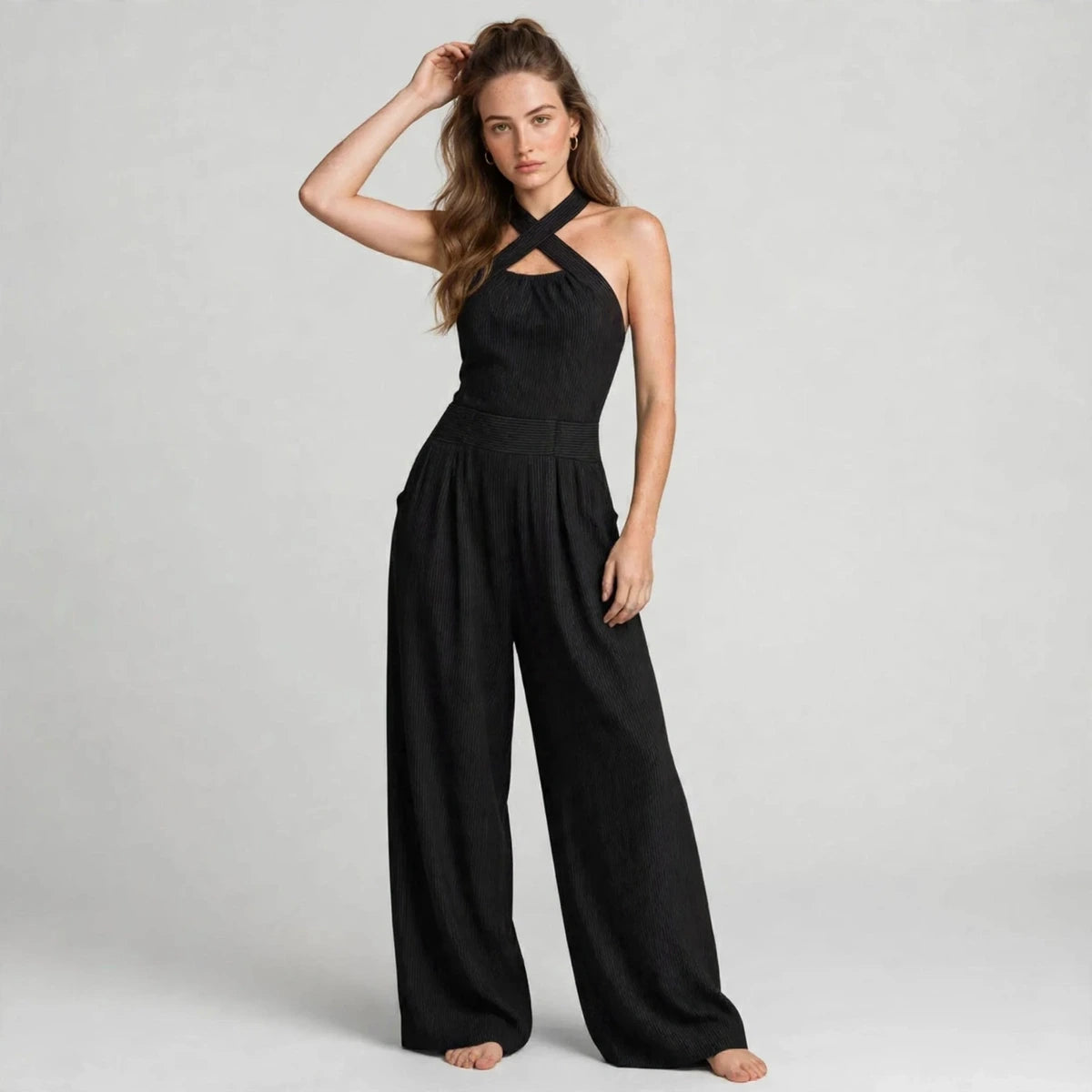 Women's black crisscross halter jumpsuit, three-quarter view