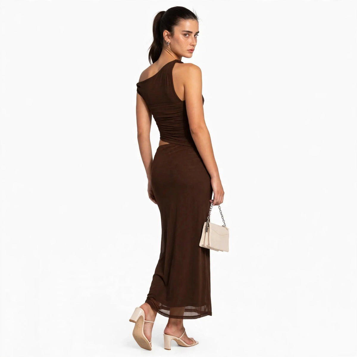 Back view of dark brown asymmetrical cutout maxi dress