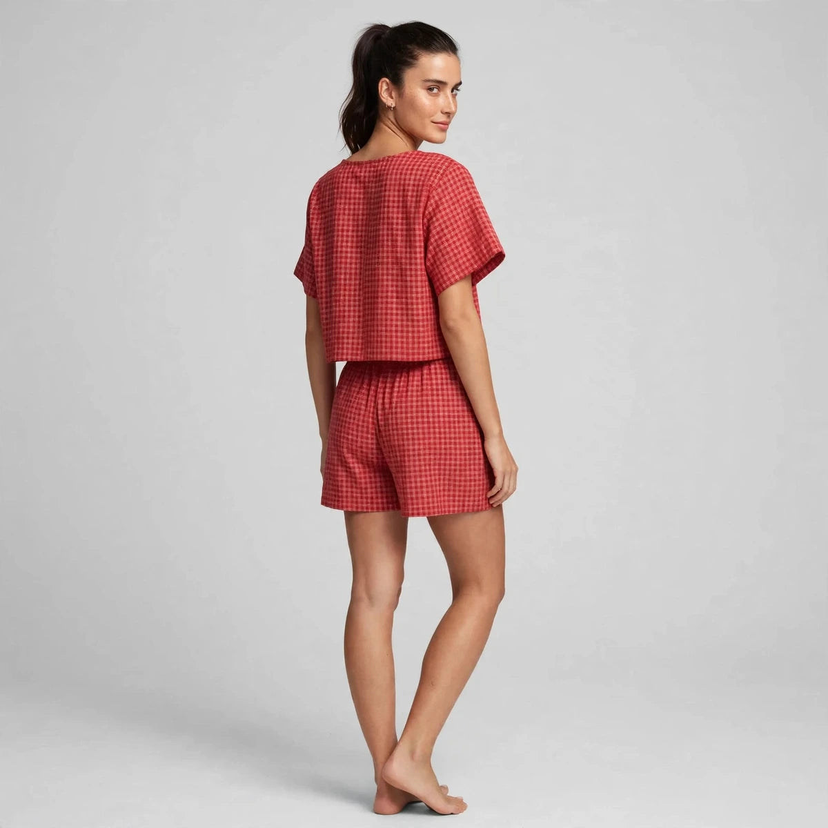 Back view of deep red plaid tie-front top and shorts set