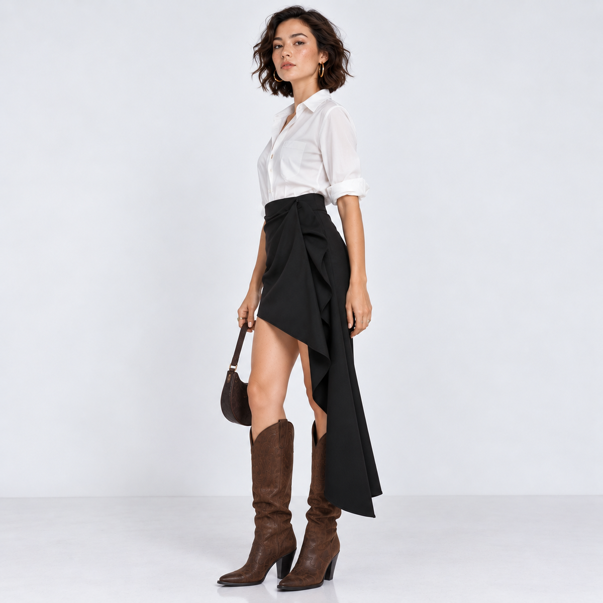 Side view of black draped mini skirt with cascading drape panel