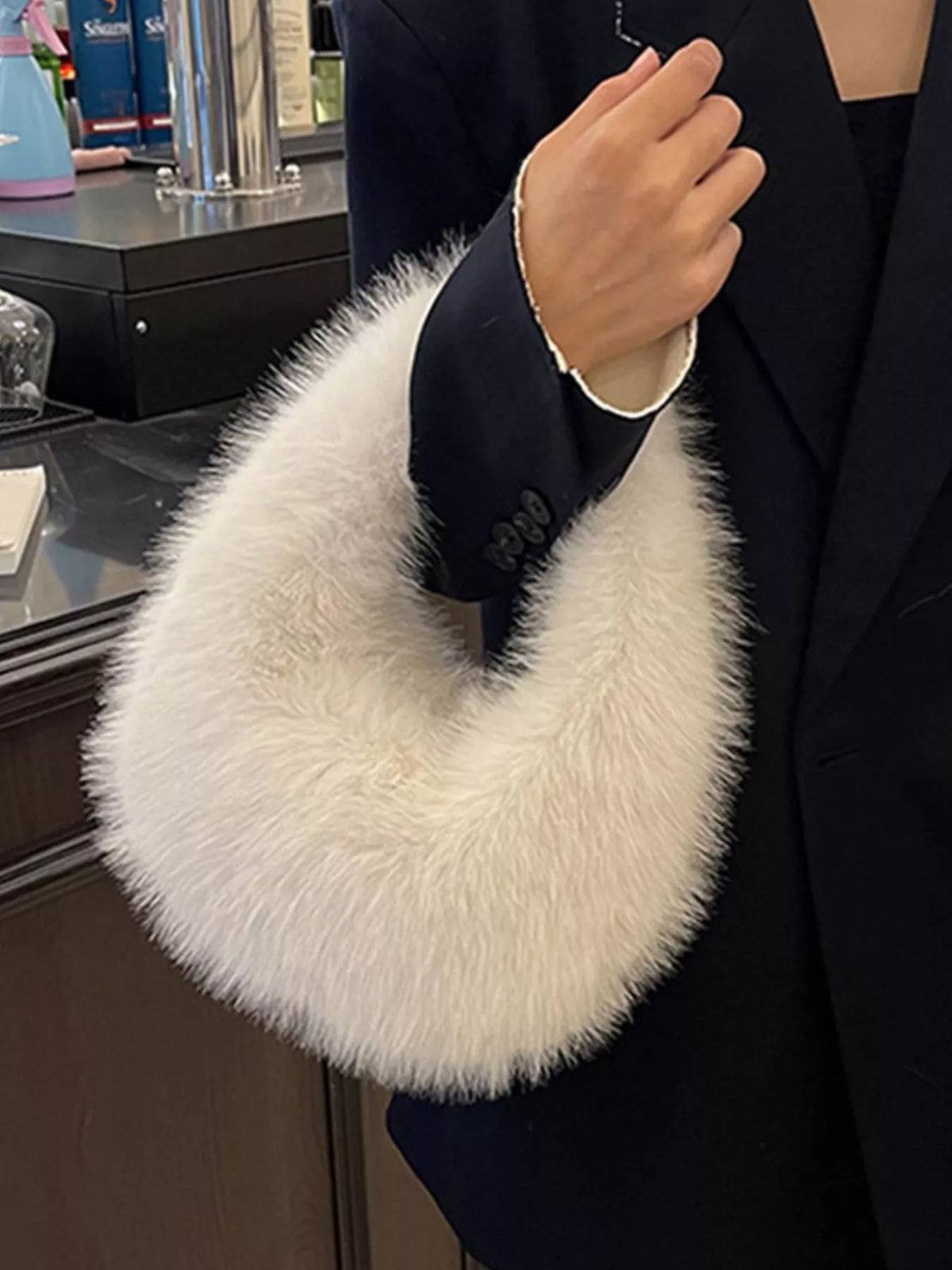 Fluffy mini handbag side detail | Orleve