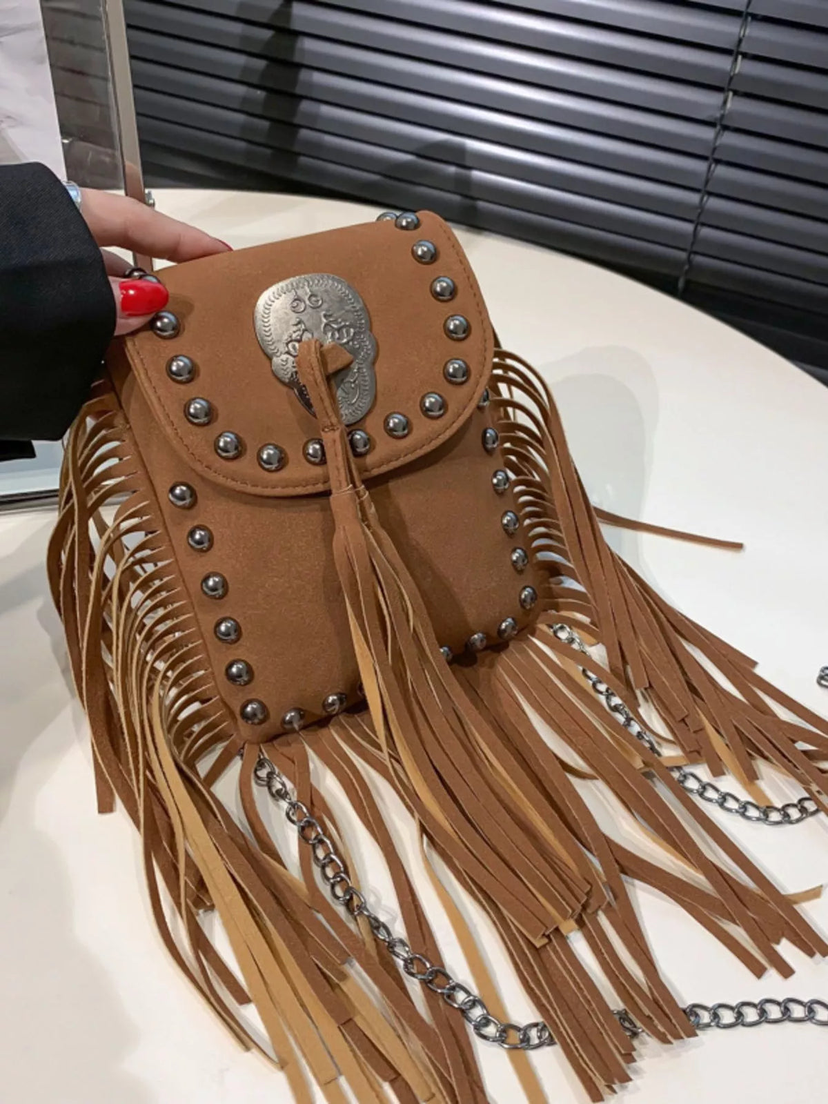 Fringe rivet mini crossbody bag side detail | Orleve