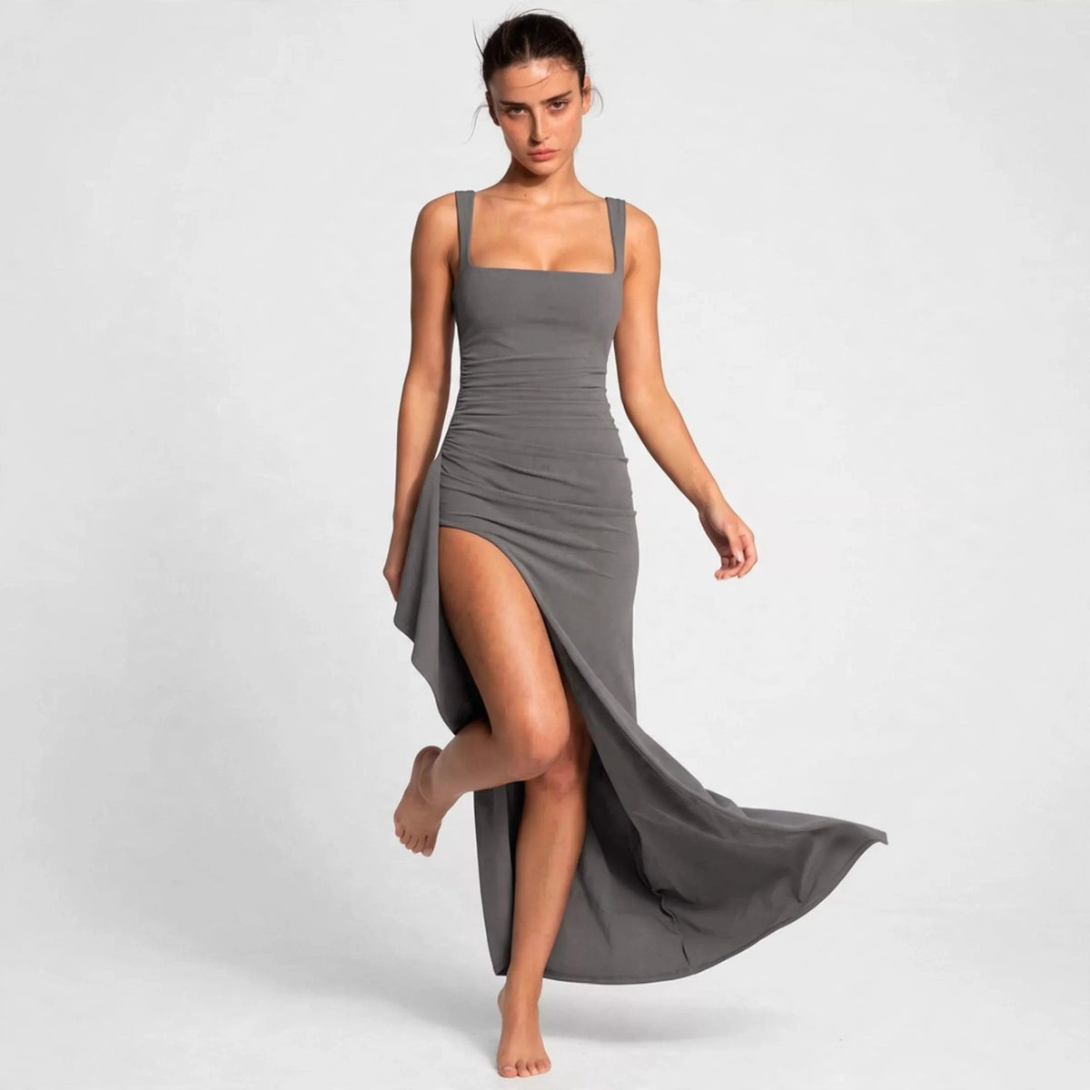 gray ruched high slit maxi dress – front view, leg lifted