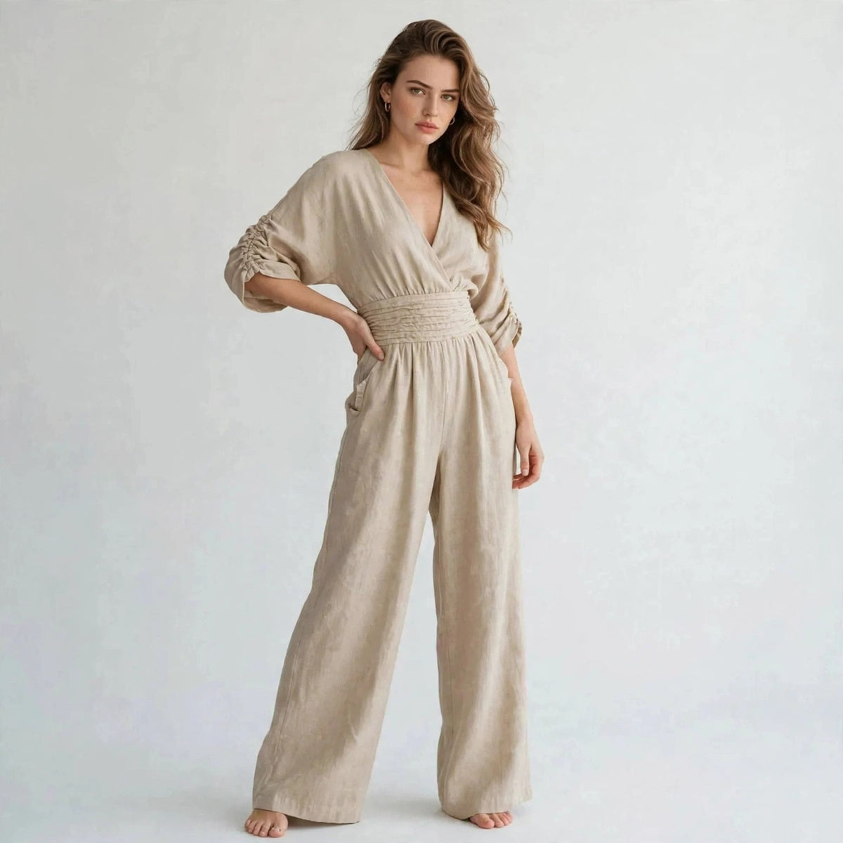 Beige half sleeve jumpsuit with v-neckline, three-quarter view
