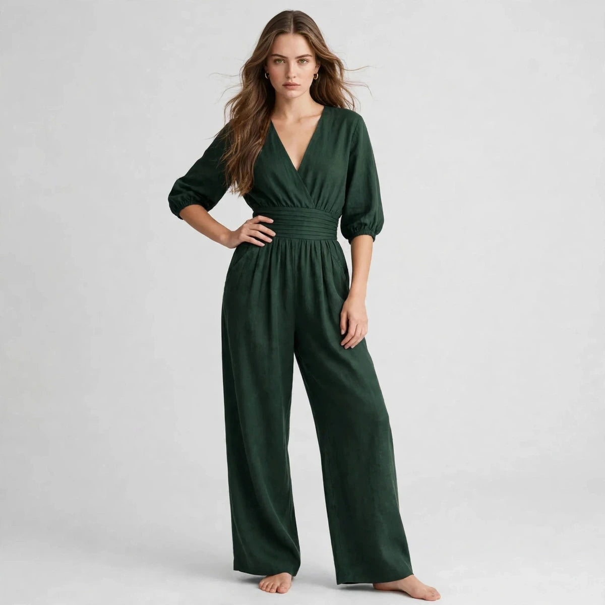 Woman wearing dark green half sleeve jumpsuit with v-neckline
