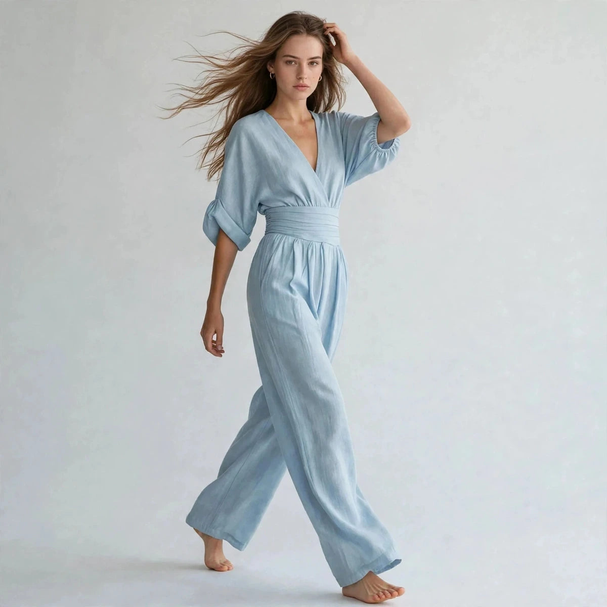 Women's light blue half-sleeve jumpsuit, three-quarter view