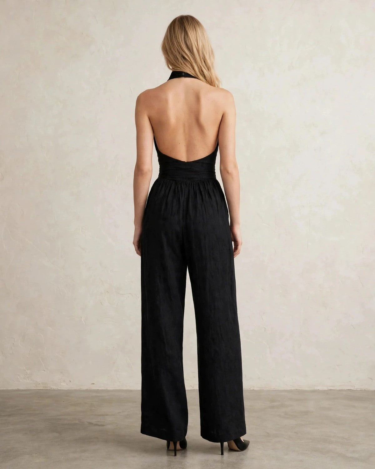 Women's halter neck wide-leg jumpsuit with waist tie in Black, back view