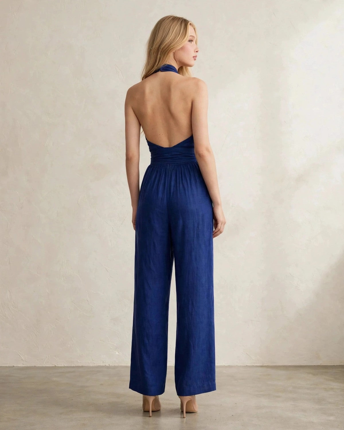Women's halter neck wide-leg jumpsuit with waist tie in Blue, back view
