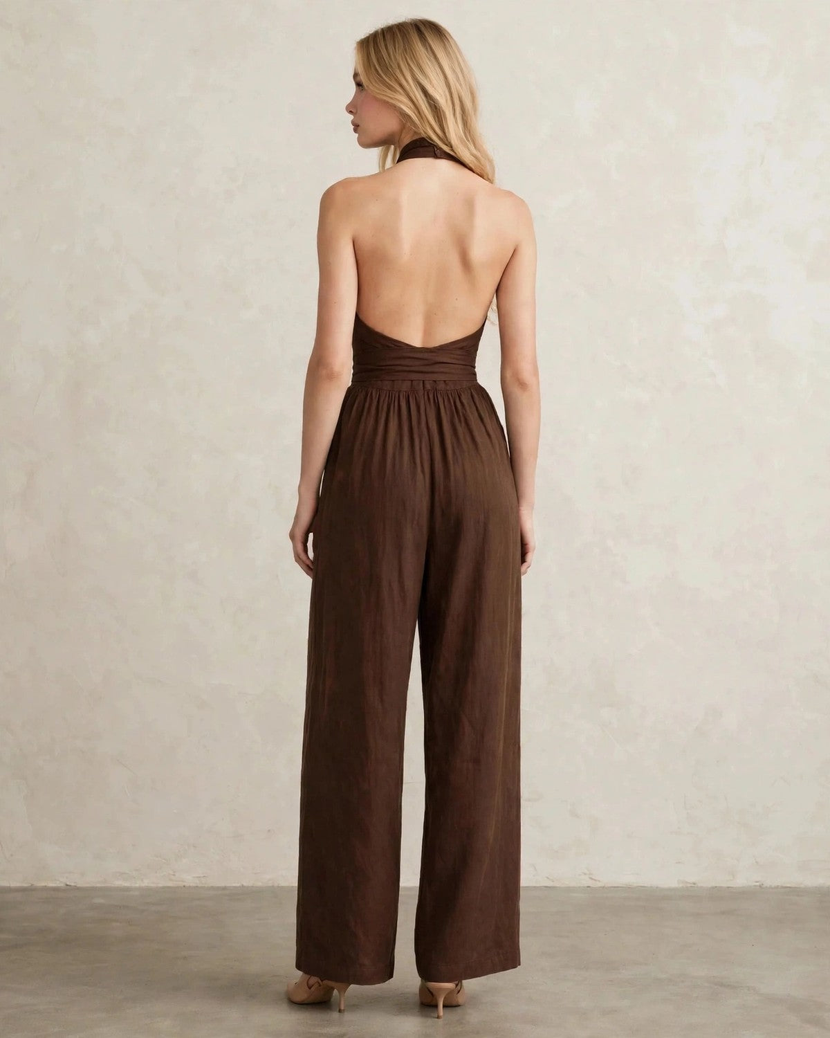 Women's halter neck wide-leg jumpsuit with waist tie in Brown, back view