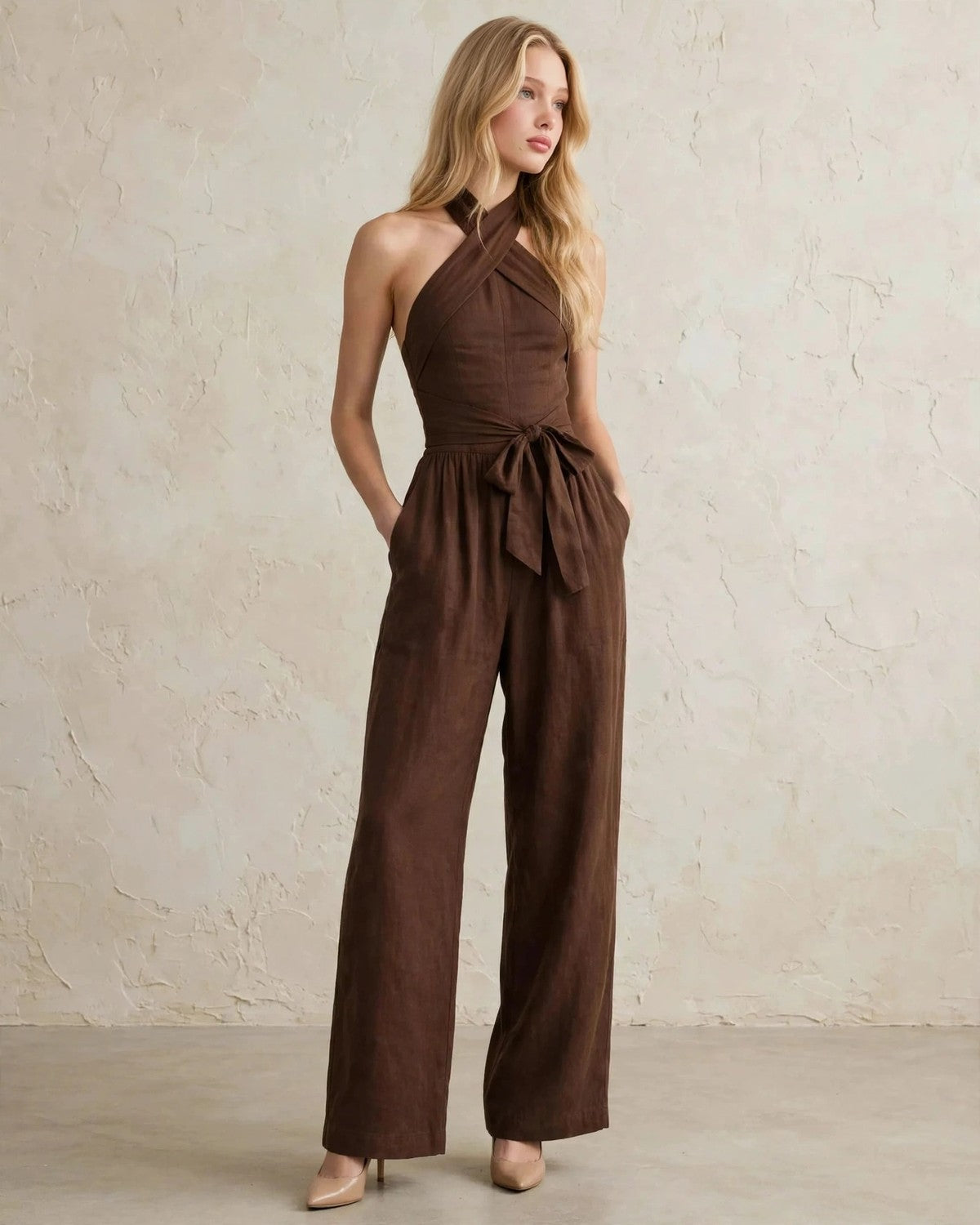 Women's halter neck wide-leg jumpsuit with waist tie in Brown, relaxed front pose