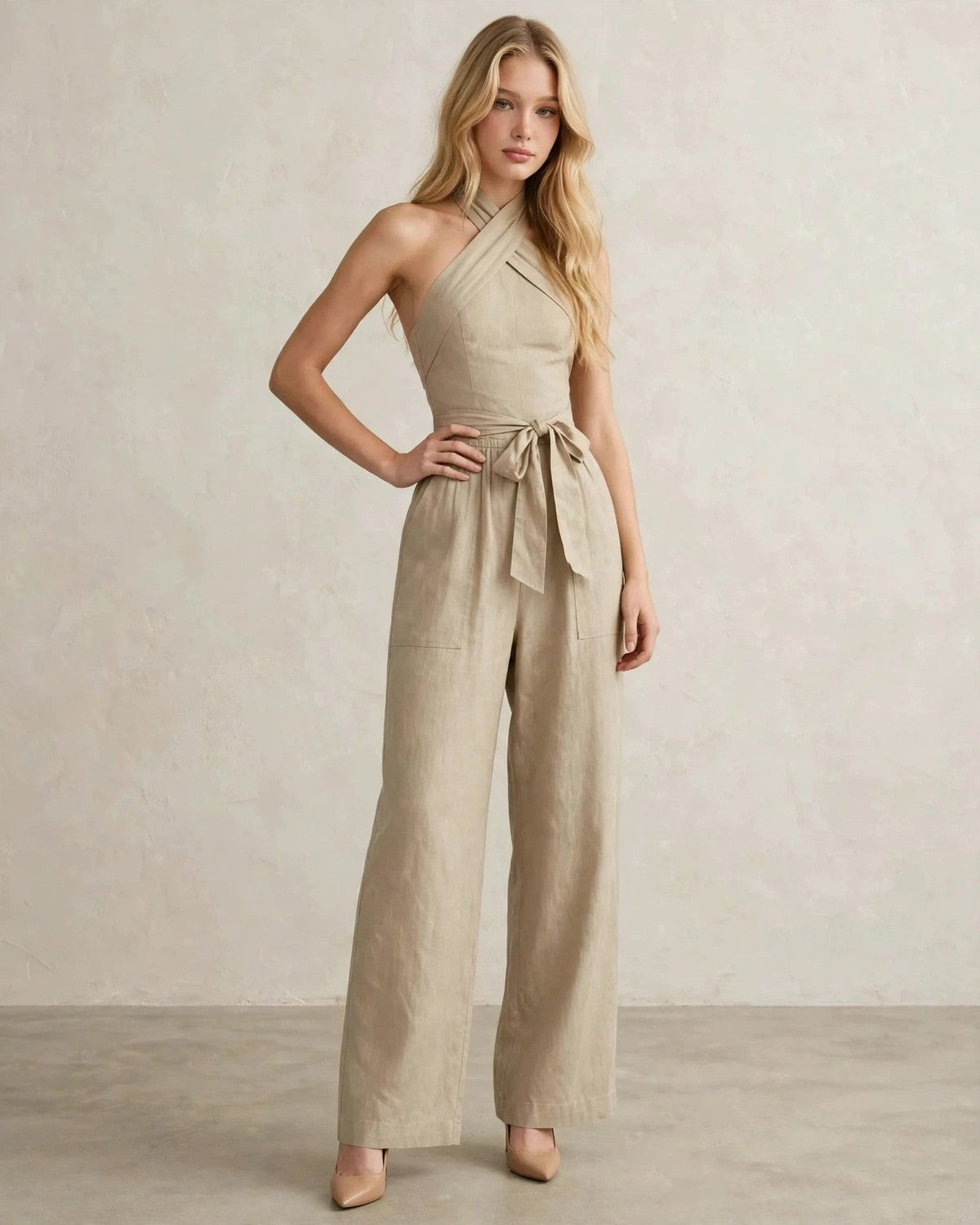 Women's halter neck wide-leg jumpsuit with waist tie in Khaki, hand at waist pose