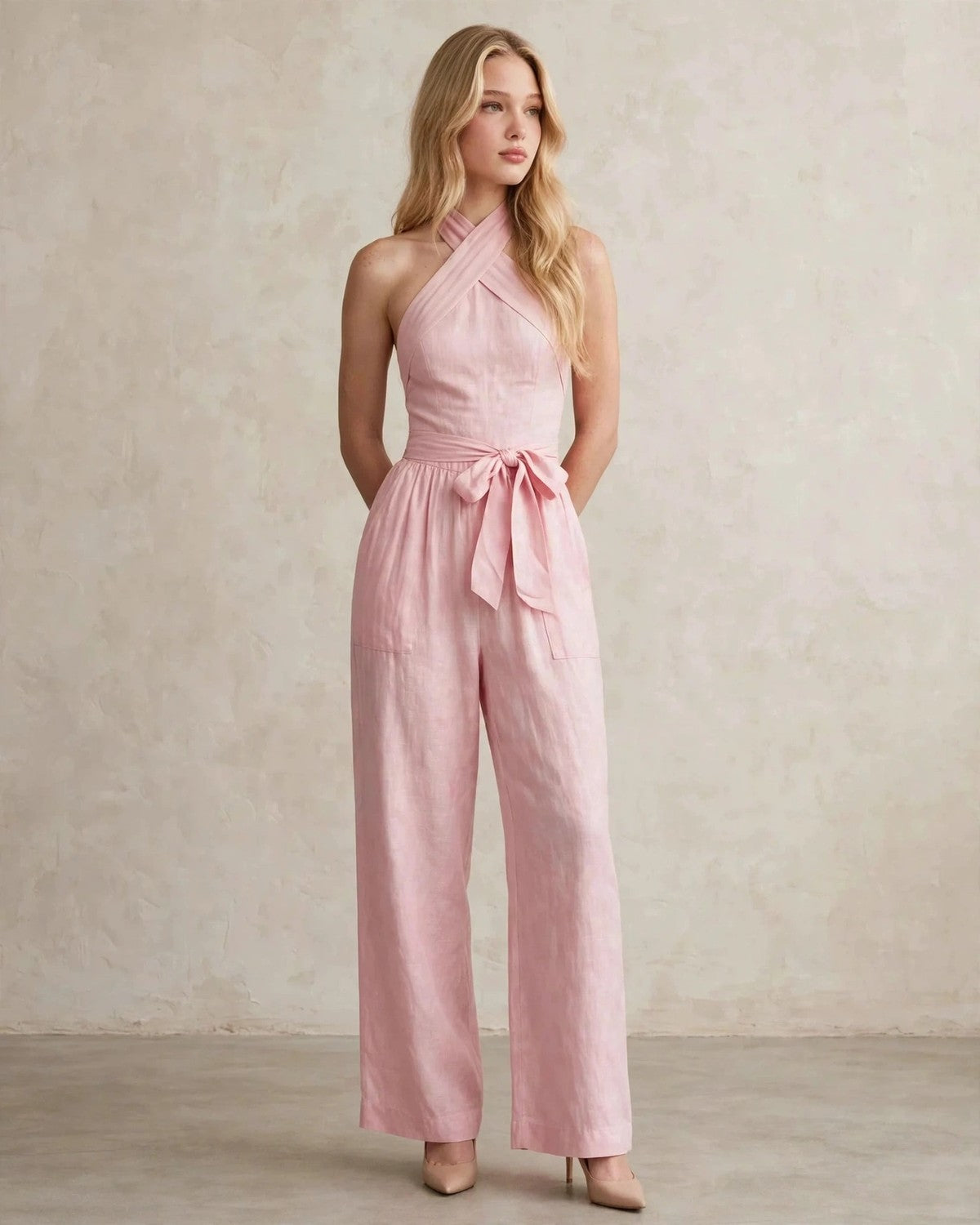 Women's halter neck wide-leg jumpsuit with waist tie in Pink, front view