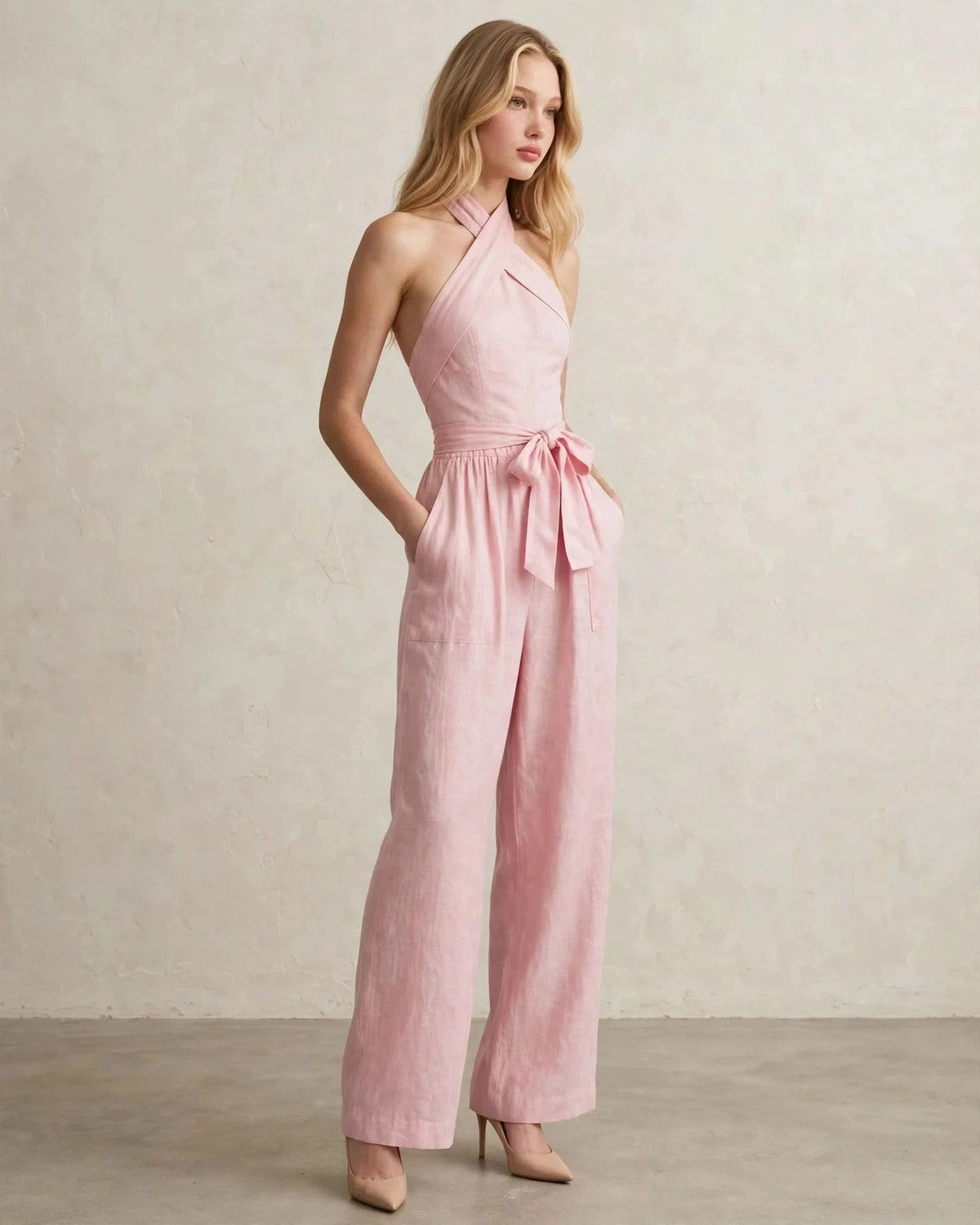 Women's halter neck wide-leg jumpsuit with waist tie in Pink, relaxed front pose