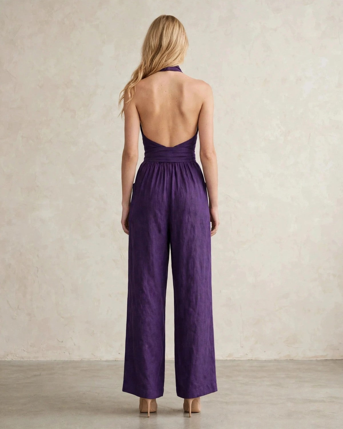 Women's halter neck wide-leg jumpsuit with waist tie in Purple, back view
