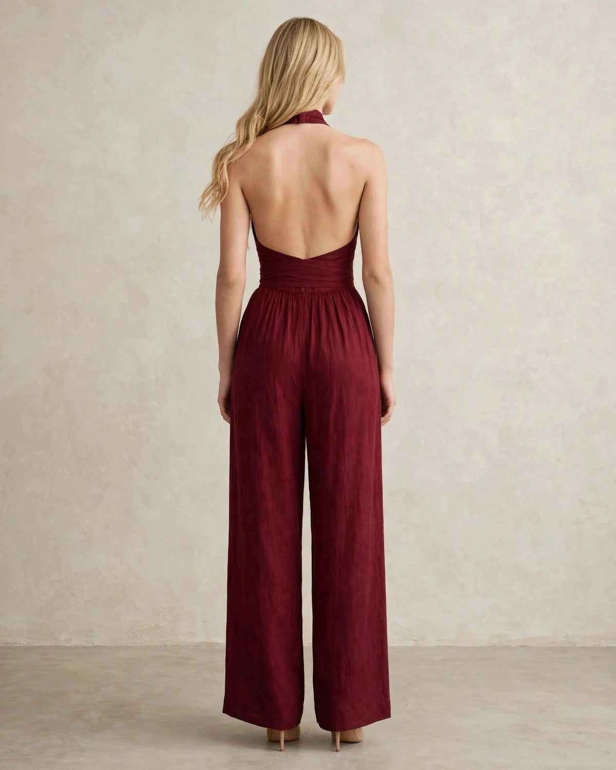 Women's halter neck wide-leg jumpsuit with waist tie in Wine Red, back view