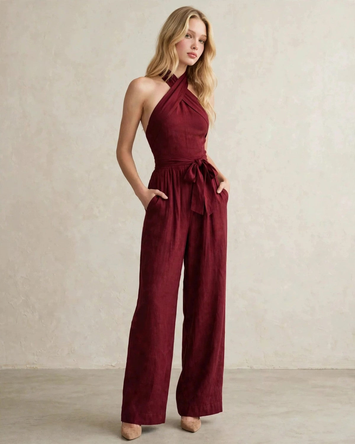 Women's halter neck wide-leg jumpsuit with waist tie in Wine Red, relaxed front pose