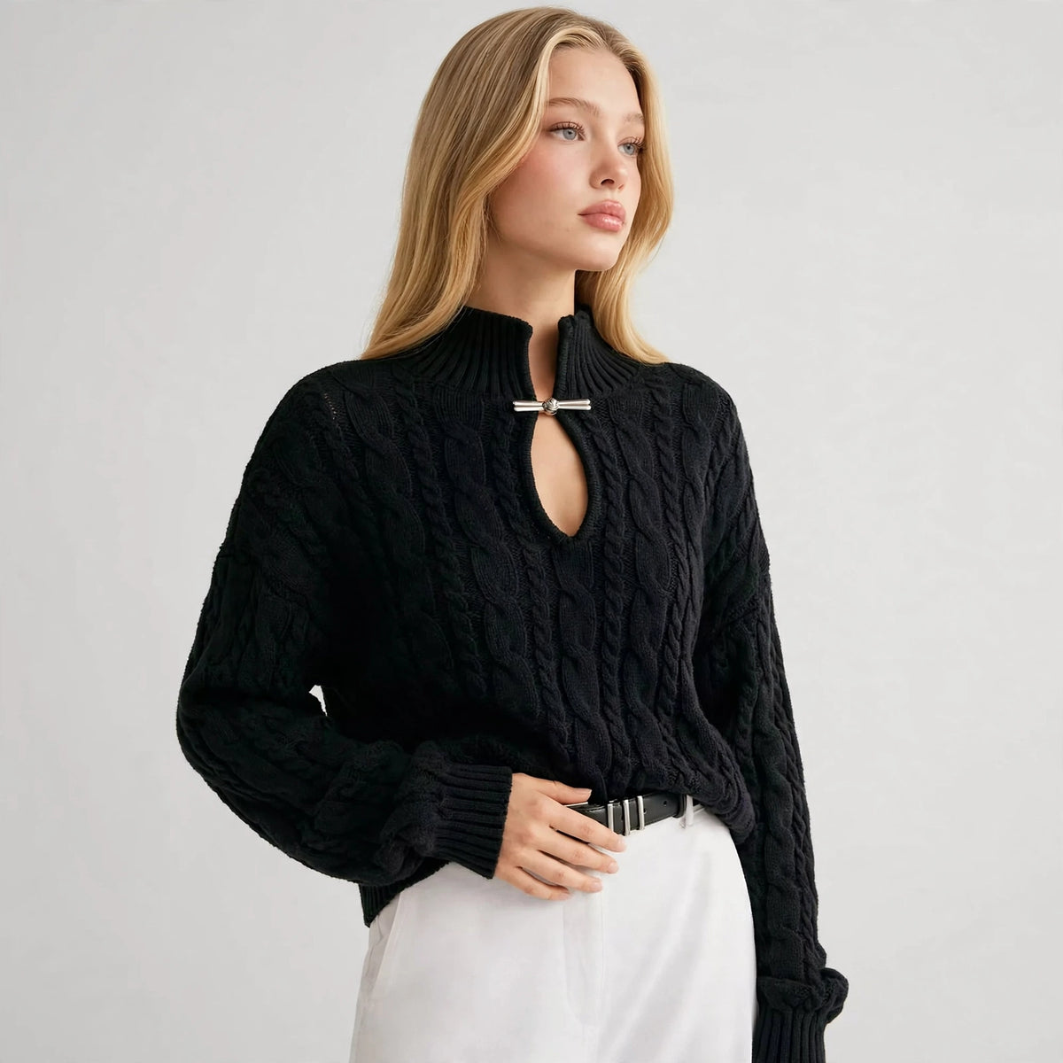 Cable-Knit Keyhole Sweater in Black – three-quarter view