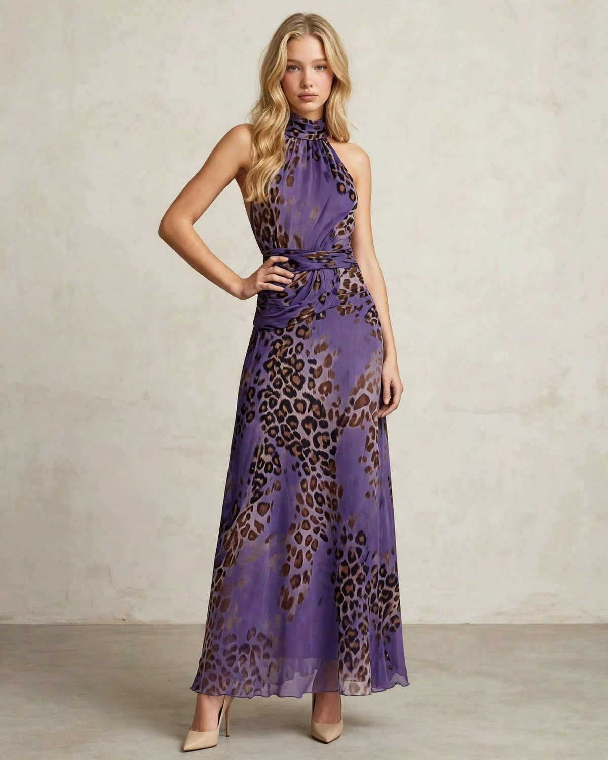 Women's leopard print halter maxi dress in purple, hand at waist pose