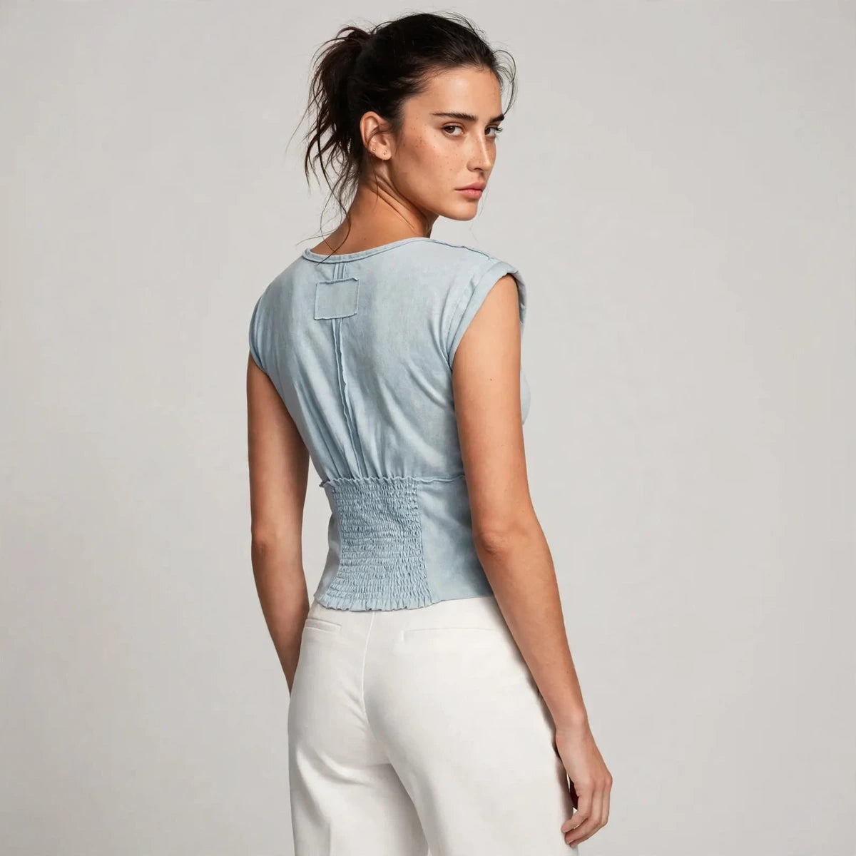 light wash blue v-neck cap sleeve cropped top – back view