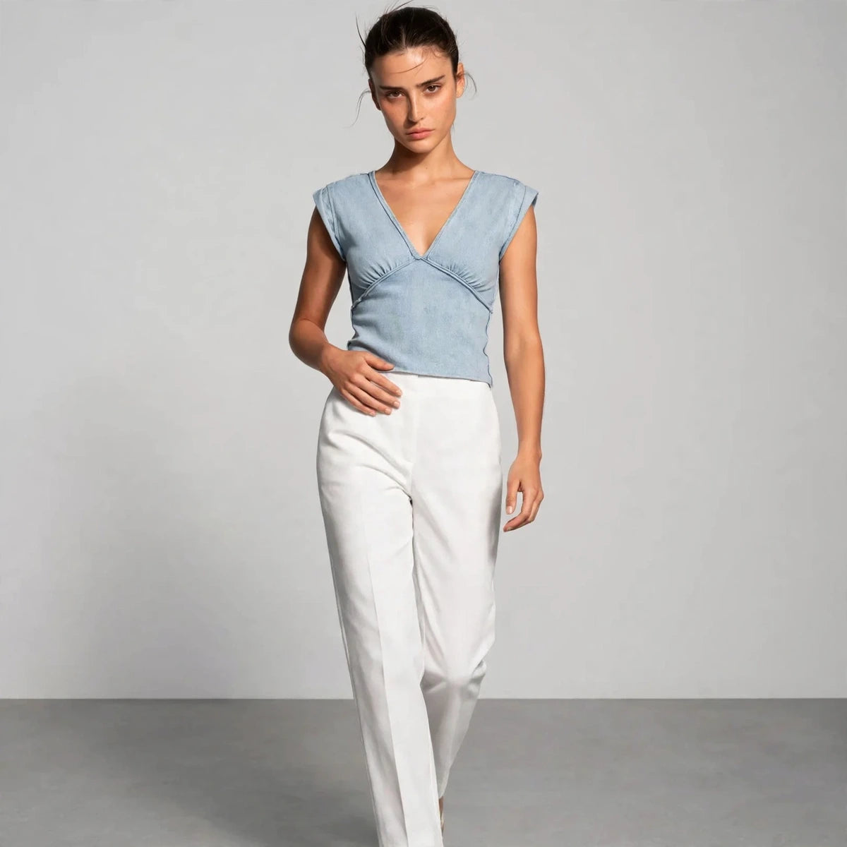 light wash blue v-neck cap sleeve cropped top – model editorial view