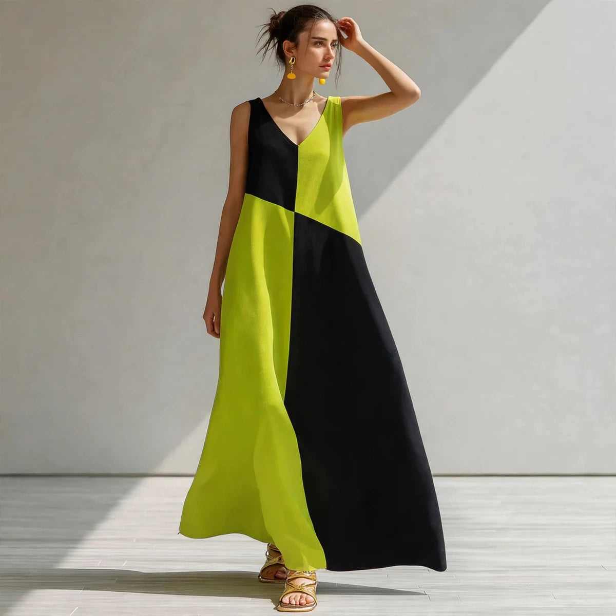 Editorial shot of lime green and black color-block sleeveless maxi dress in sunlight