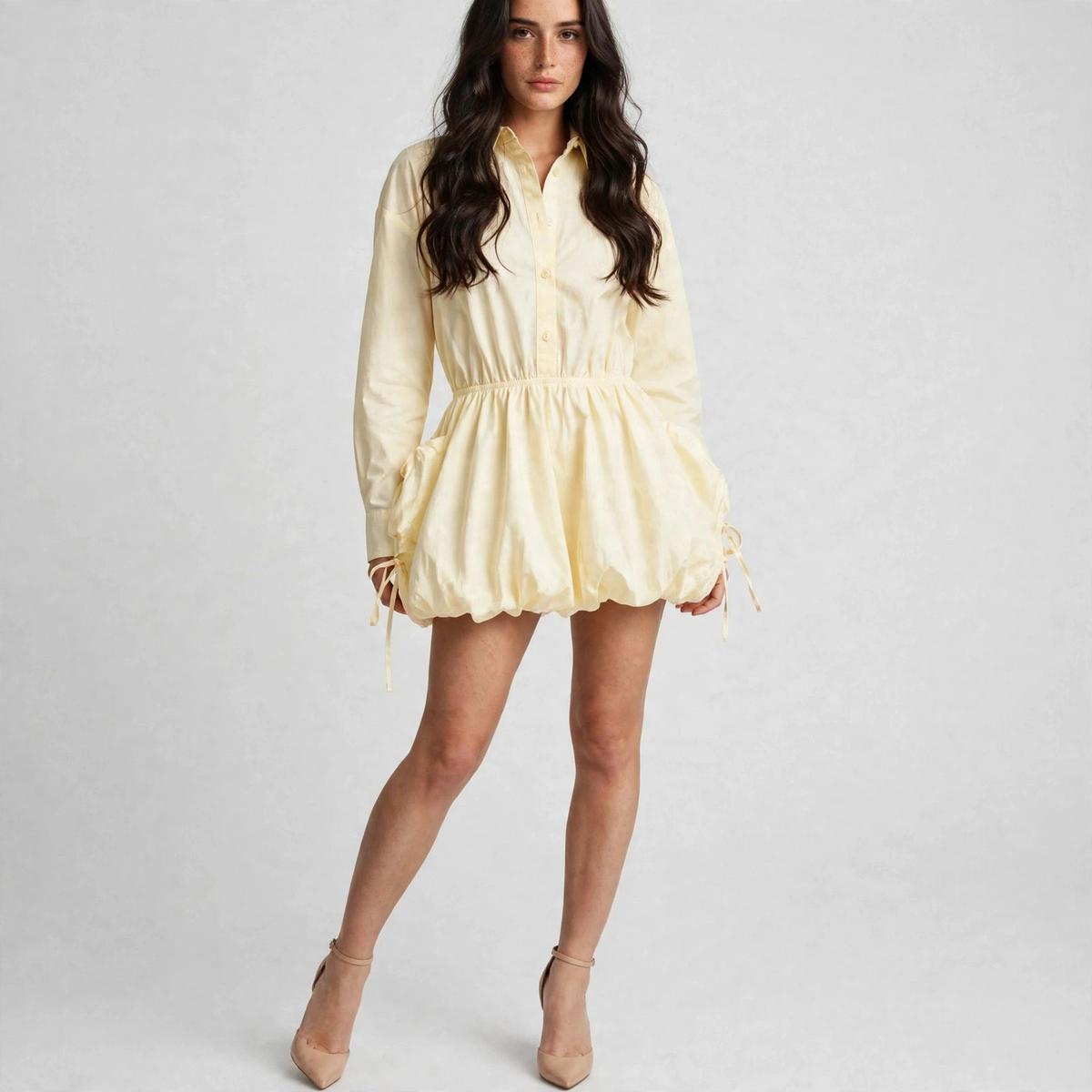 Front view of pastel yellow long-sleeve bubble shirt dress