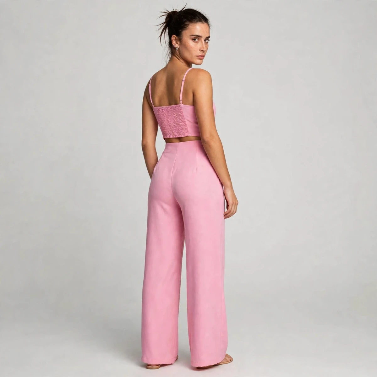 Back view of pink smocked cami top with wide-leg pants