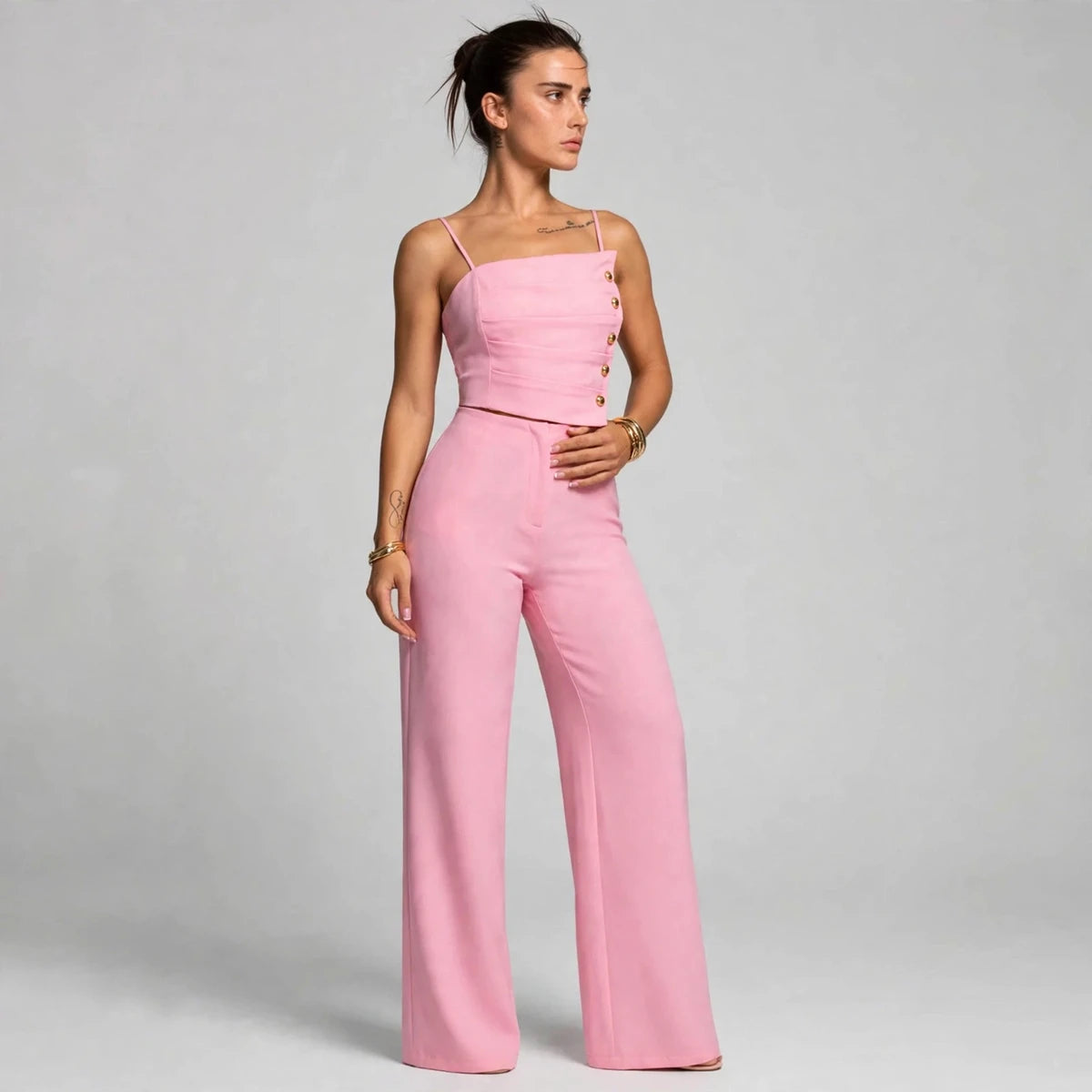 Side view of pink button cami top and wide-leg pants set