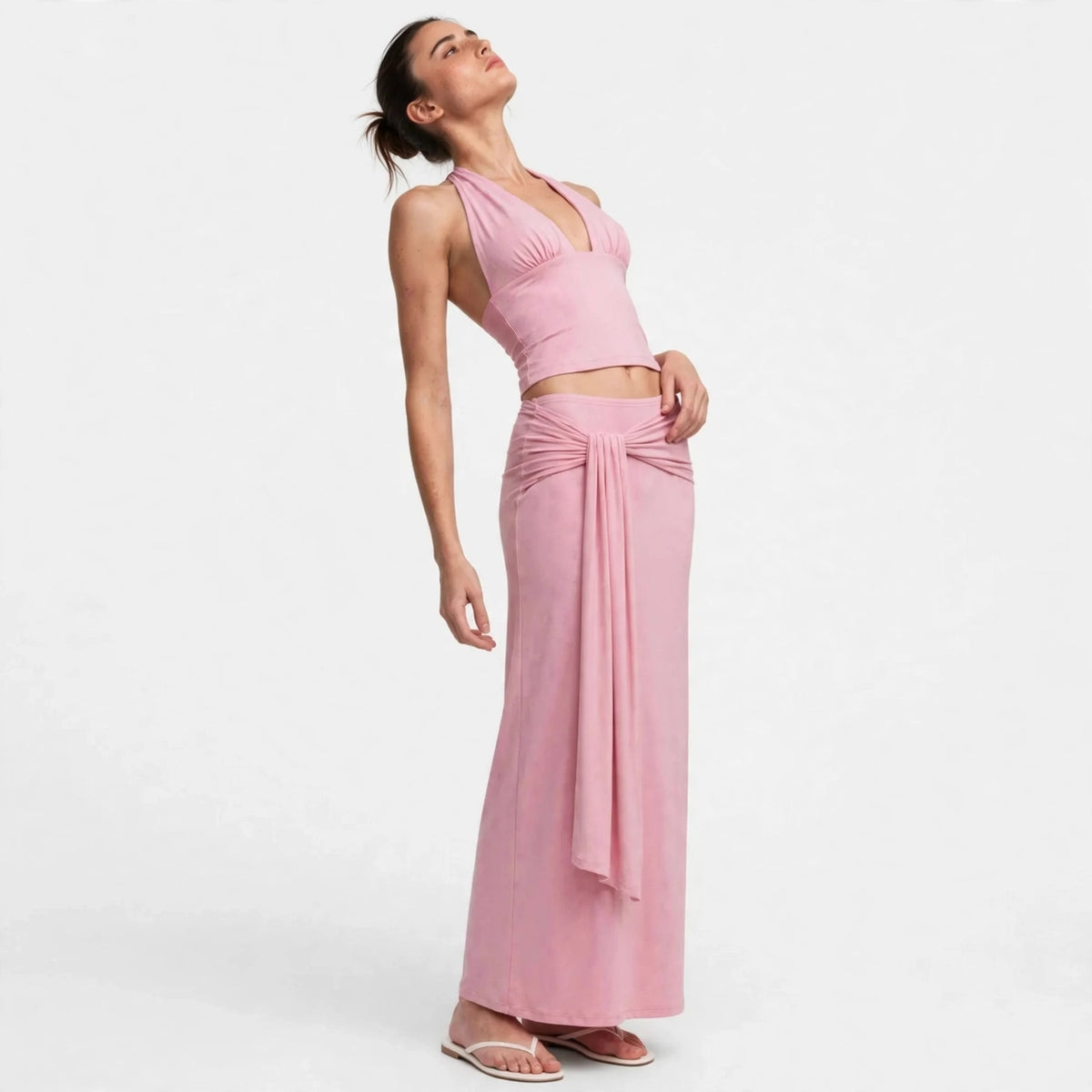 Close-up of pink halter top with twisted waist drape skirt