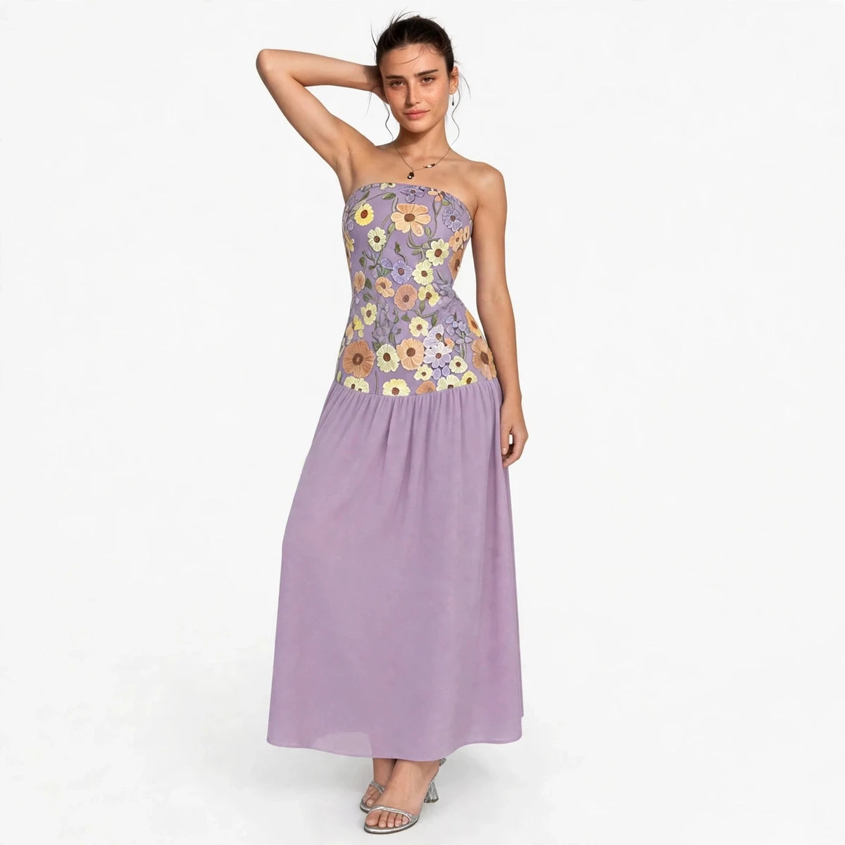 Woman wearing purple floral embroidered tube maxi dress, front view