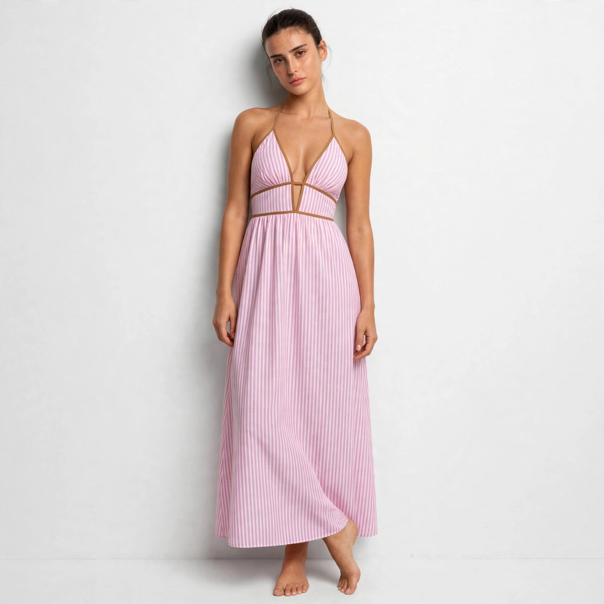 pink striped halter maxi dress – front view, leaning on wall