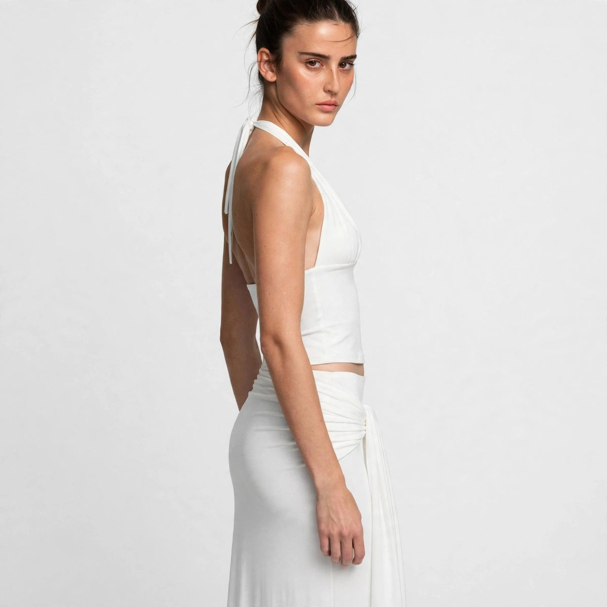 Back detail view of white halter top showing tie straps