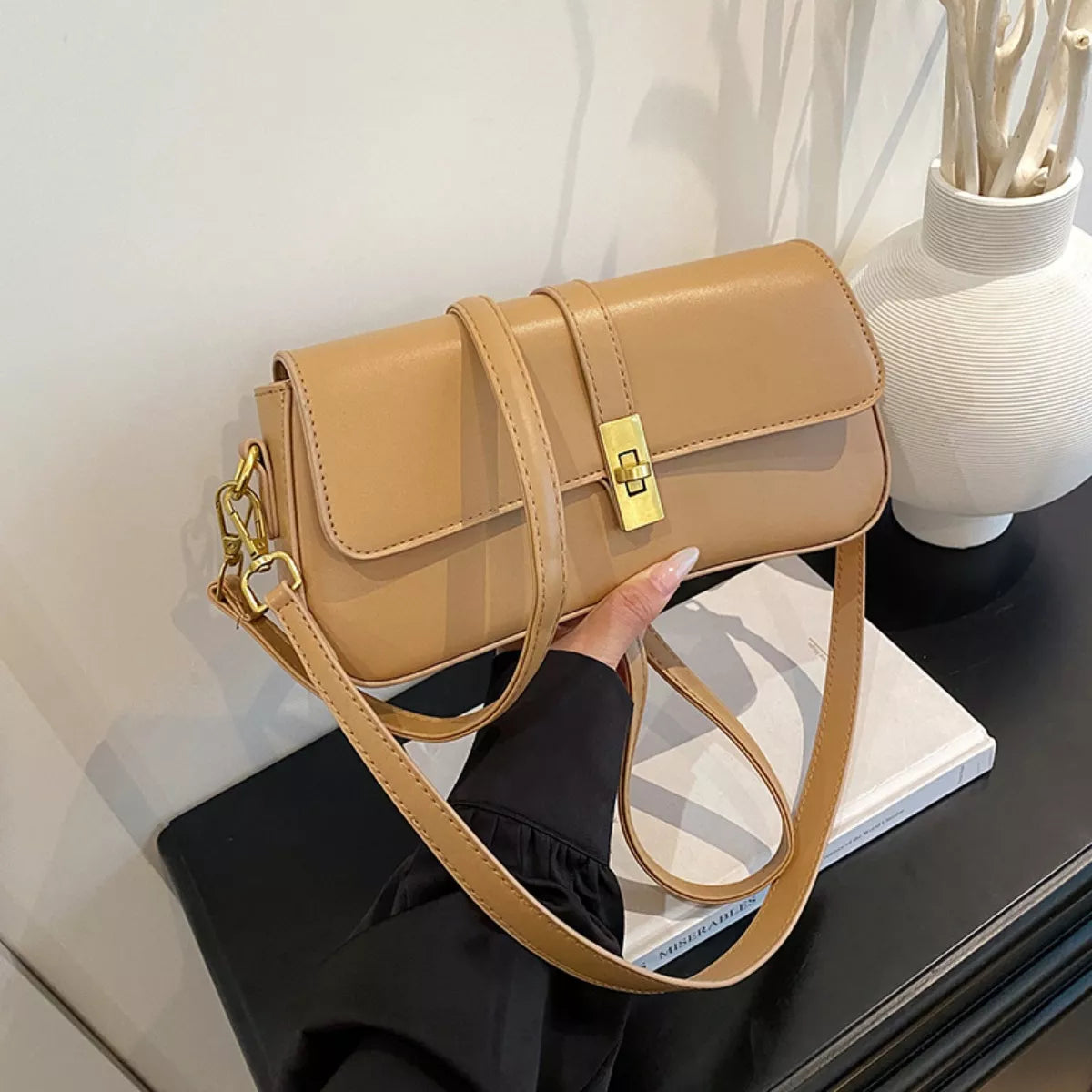 Rectangular golden buckle crossbody bag silhouette | Orleve