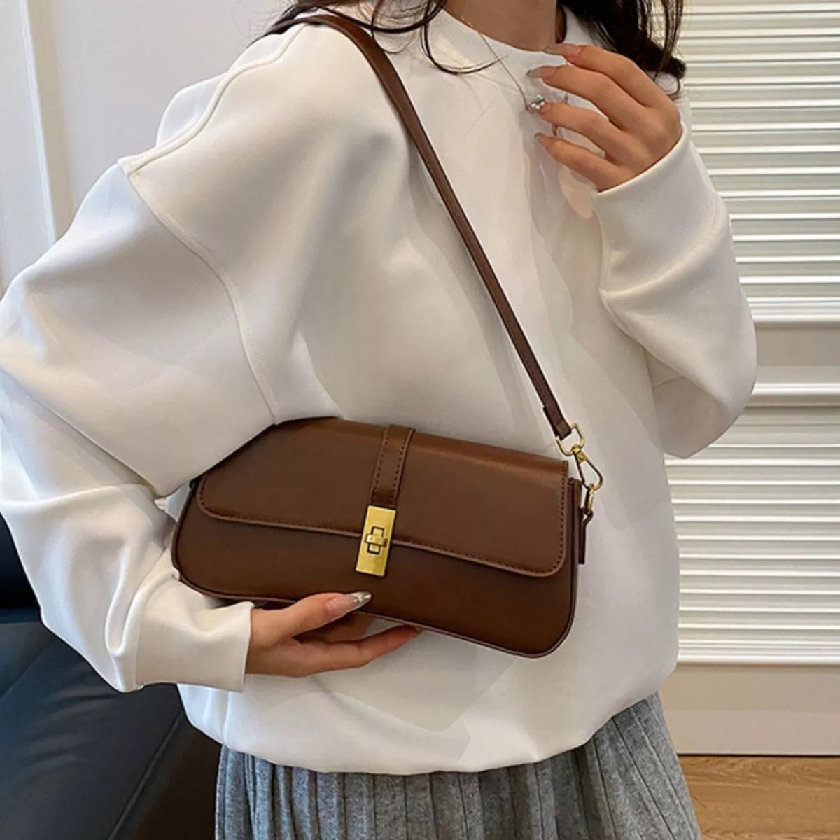 Rectangular golden buckle crossbody bag texture view | Orleve
