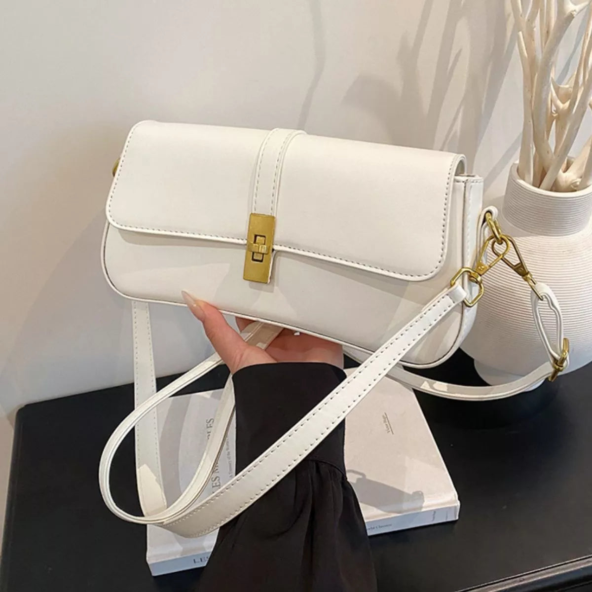 Rectangular golden buckle crossbody bag close view | Orleve