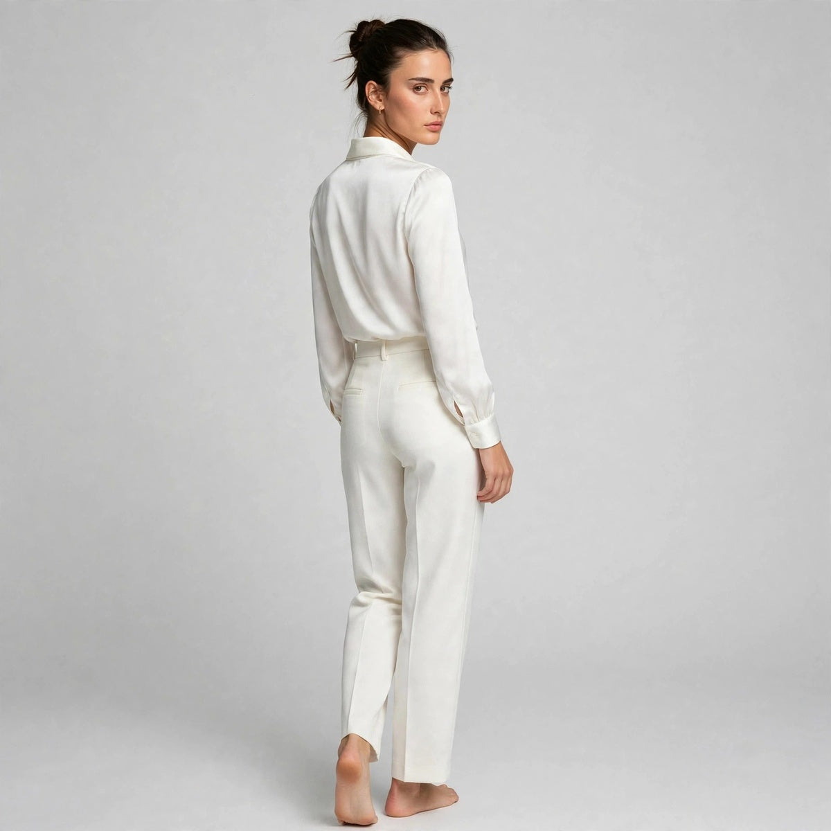 Back view of white satin tie-neck blouse with shawl collar