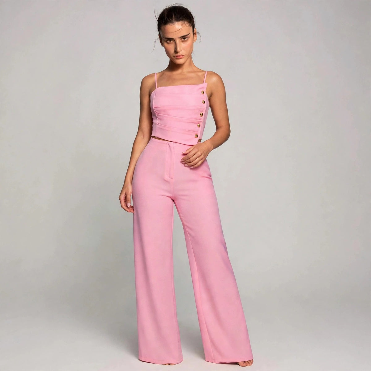 Model in pink button cami top and wide-leg pants set, front view