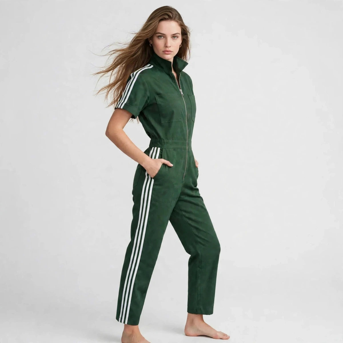 Three-quarter view of green sporty stripe zip-front jumpsuit with white stripes